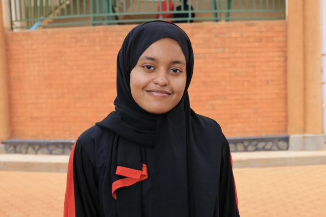 Mariem Agabani, a Sudanese refugee and medical student, continues her studies at Sudan International University, hosted by the Islamic University in Uganda. She fled Khartoum with her family in 2023 and is now gaining hands-on experience at Mulago National Referral Hospital.